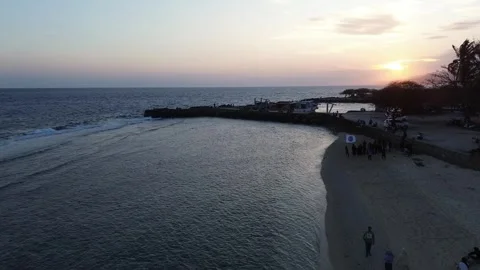 Aerial view of People bathing in the sun, and playing games on the beach Stock Footage 254222935