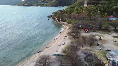 Aerial view of People bathing in the sun and playing games on the beach Stock-Footage 254579644