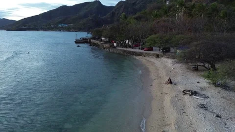 Aerial view of People bathing in the sun and playing games on the beach Stock-Footage 254581459