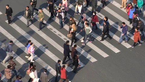 Aerial view of people on busy pedestrian crossing, Shanghai, China Stock Footage
