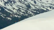 Aerial View Of People Climbing A Snow Covered Mountain In Alaska Usa Stock Footage