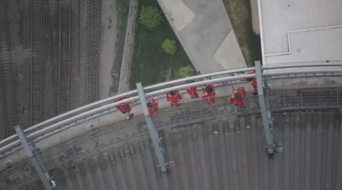 Aerial view on people doing the edge walk at the CN Tower in Toronto Stock Footage 64923099