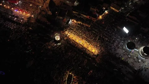 Aerial view of people at Ganges river at night in Ganga Aarti, Varanasi, India. Stock Footage 249687038
