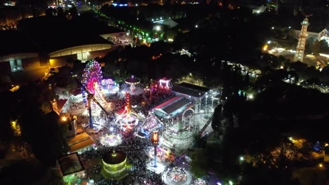 Aerial view of people having fun in amusement park and colorful toys, game Stock Footage 236463100