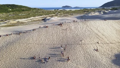 Aerial view of people having fun on the dunes of Ingleses in Florianópolis Stock Footage 319970157