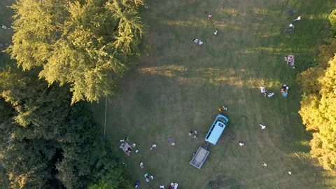 Aerial view of people looking at how hot air balloons prepare for an summer Stock Footage 139102741