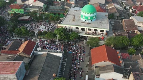 Aerial View of People offering prayers on the Eid morning at famous mosque Stock Footage 154376225