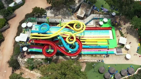 Aerial view of people sliding down a wat... | Stock Video | Pond5