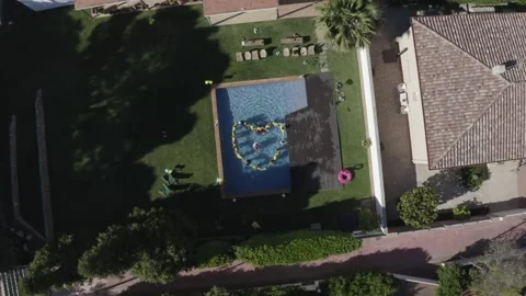 Aerial view of people stand in shape of heart in swimming pool. Summer vacation Stock Footage 131281806