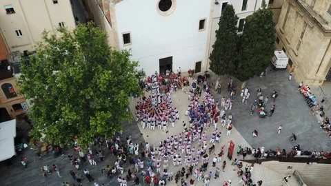 Aerial view people train to make human castles in Spain Stock Footage 103286664