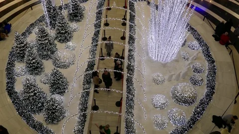 Aerial view of people walking inside an artificial Christmas decoration square Stock Footage 71147536
