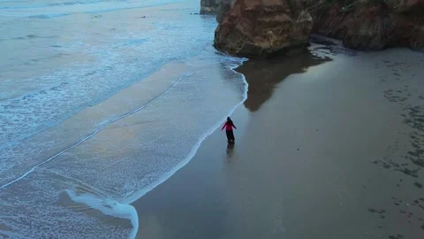 Aerial view of person walking on beach in Indonesia. Stock Footage 340342004