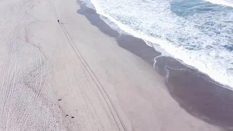 Aerial View Of Person Walking On Empty Beach. Stock-Footage 322640292