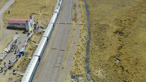Aerial view of a peruvian train stopped in peruvian highlands Video stock 115995315