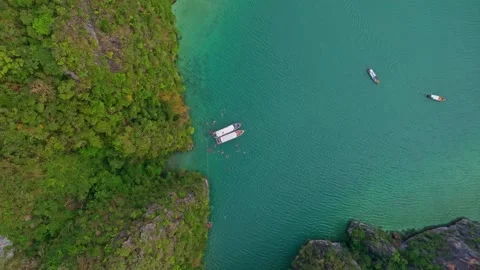 Aerial view of Phi Leh Bay lagoon with boats and swimmers, Thailand Stock Footage 303357924