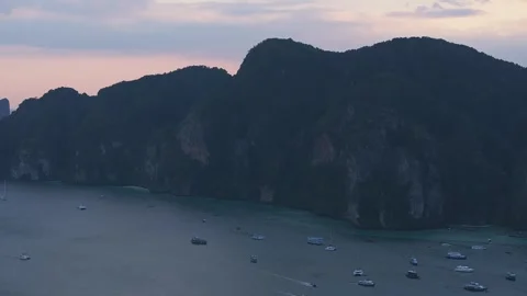Aerial View of Phi Phi Island at Sunset with Limestone Cliffs and Boats 動画素材 297410936