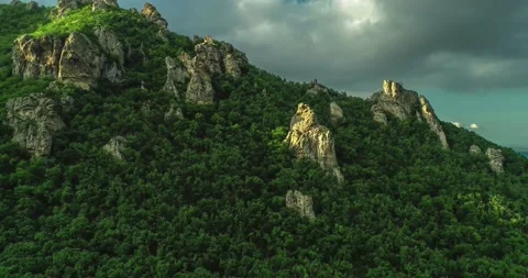 Aerial view of picturesque cliffs and green mountain slopes outside the city. Stock Footage 158401008