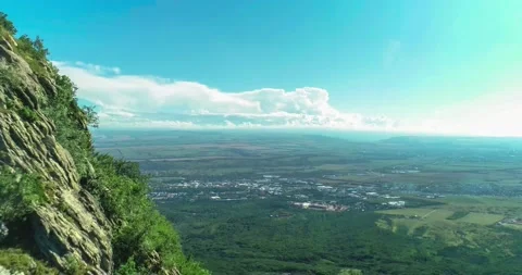 Aerial view of picturesque cliffs and green mountain slopes outside the city. Stock Footage 158401031
