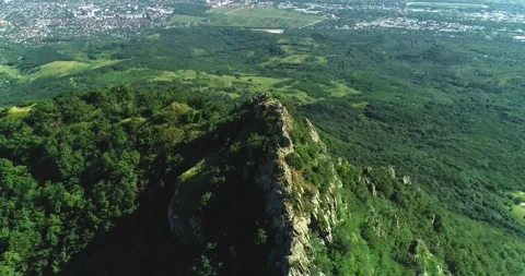 Aerial view of picturesque cliffs and green mountain slopes outside the city. Stock Footage 158401683
