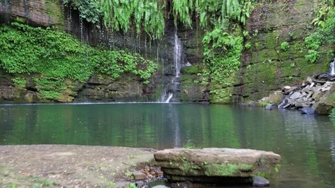 Aerial view of picturesque unique waterfall on the island of Nosy be.Madagascar. Stock Footage 231994341