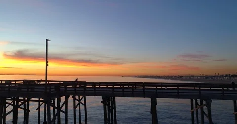 Aerial view of pier and the ocean in Orange County California at sunset Stock Footage 85458586