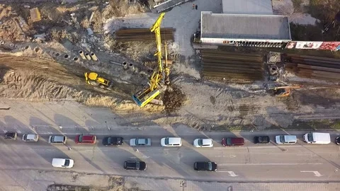 Aerial view of pile driver machine working at construction site Stock Footage 346410275