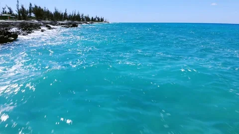Aerial View of Pinders Point Lighthouse and Waves on Rocky Shore, Bahamas Stock Footage 107295529