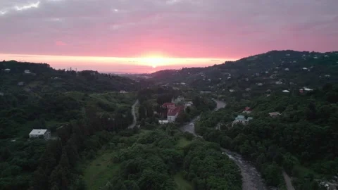 Aerial view on pink sunset in mountain village Stock Footage 213683404