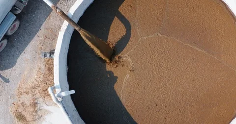 Aerial view of a pipe is pumping organic cow  manure compost  used for biogas. Stock Footage 121544083