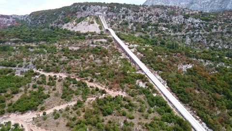 Aerial View of Pipeline Running Through Mountainous Vegetation Video stock 342774615