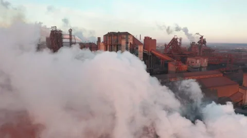Aerial view. Pipes Throwing Smoke in the Sky at the sunset. Vídeo Stock 165691807