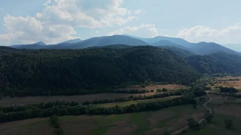 Aerial view of Pirin Mountain forests and fields near Dobrinishte, Bulgaria Stock Footage 343630830