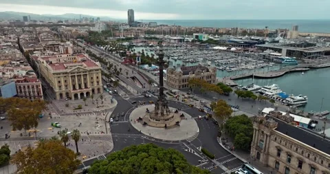 Aerial view of Placa de les Drassanes in Barcelona, Spain: Traffic moving along Stock-Footage 315286182