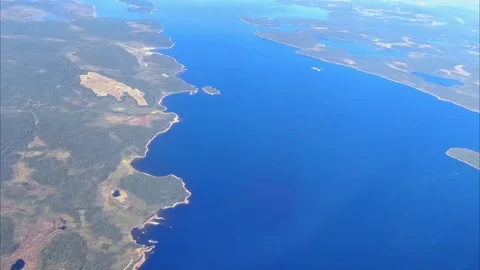 Aerial view from plane Window. Beautiful blue lakes on the Kola Peninsula. Stock Footage 283975903