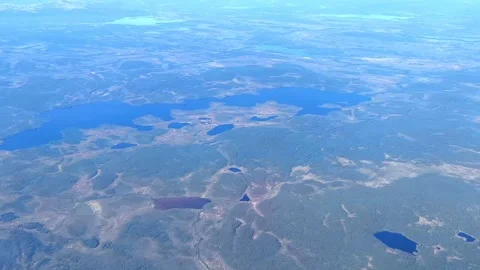 Aerial view from plane Window. Beautiful blue lakes on the Kola Peninsula. 動画素材 286144229