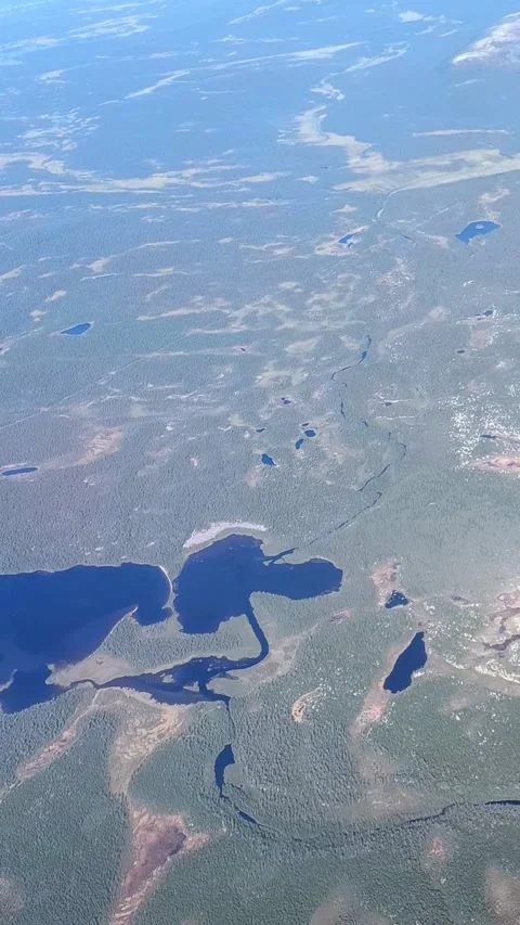 Aerial view from plane Window. Beautiful blue lakes on the Kola Peninsula. Stock Footage 286145422