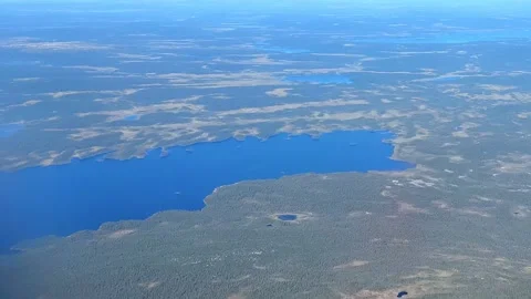 Aerial view from plane Window. Beautiful blue lakes on the Kola Peninsula. Видео 286196735