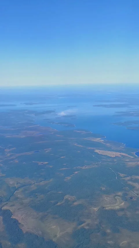 Aerial view from plane Window. Beautiful blue lakes on the Kola Peninsula. Stock Footage 286836543
