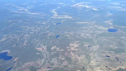 Aerial view from plane Window. Beautiful blue lakes on the Kola Peninsula. Stockbeeldmateriaal 286873275