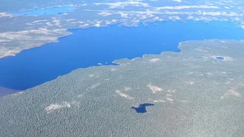 Aerial view from plane Window. Beautiful blue lakes on the Kola Peninsula. Stock Footage 289671413