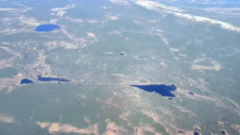 Aerial view from plane Window. Beautiful blue lakes on the Kola Peninsula. Stock Footage 289959828