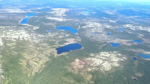 Aerial view from plane Window. Beautiful blue lakes on the Kola Peninsula. Stock Footage 290170860