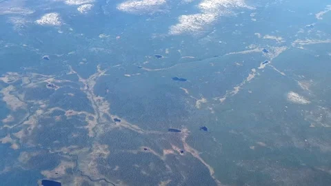 Aerial view from plane Window. Beautiful blue lakes on the Kola Peninsula. 스톡 동영상 291277399