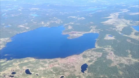 Aerial view from plane Window. Beautiful blue lakes on the Kola Peninsula. Stock Footage 294339784