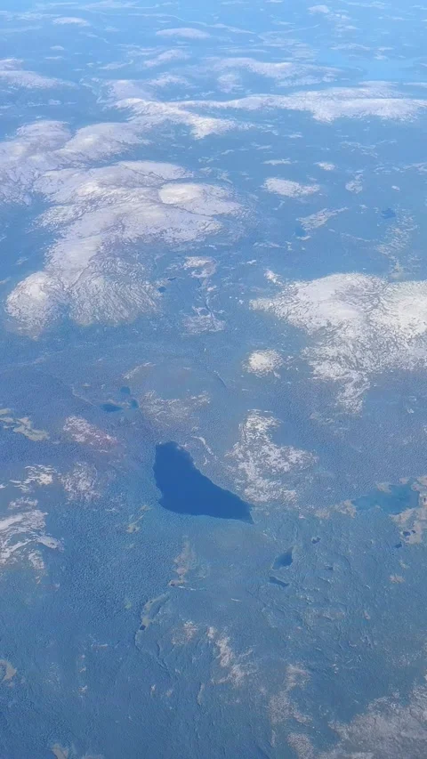 Aerial view from plane Window. Beautiful blue lakes on the Kola Peninsula. Stock Footage 294347213