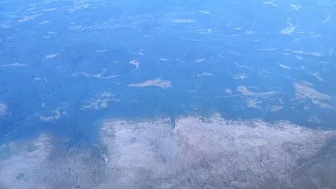 Aerial view from plane Window. Beautiful landscape on the Kola Peninsula. Hills. Stock Footage 295380984