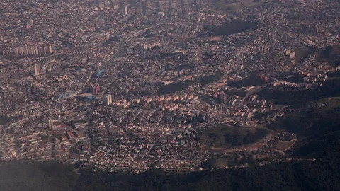 Aerial view from plane window of dense urban landscape with houses and transport 스톡 동영상 101301771