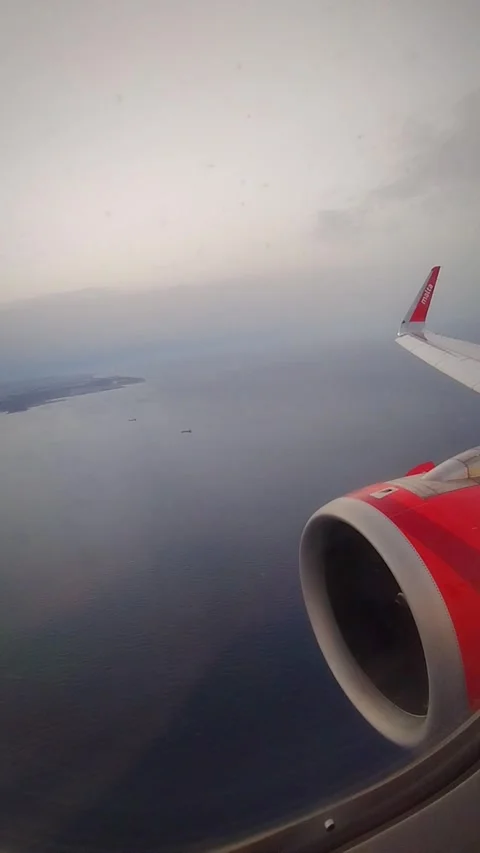 Aerial View from a Plane Window Over the Ocean Video stock 281498936