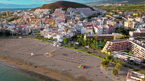 Aerial view of Playa de Los Cristianos popular sunbathing beach in Tenerife. Stock Footage 259333410