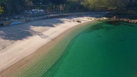 Aerial view of Playa de Portocelo in Marín, Galicia, Spain, featuring golden san Stock Footage 304635336